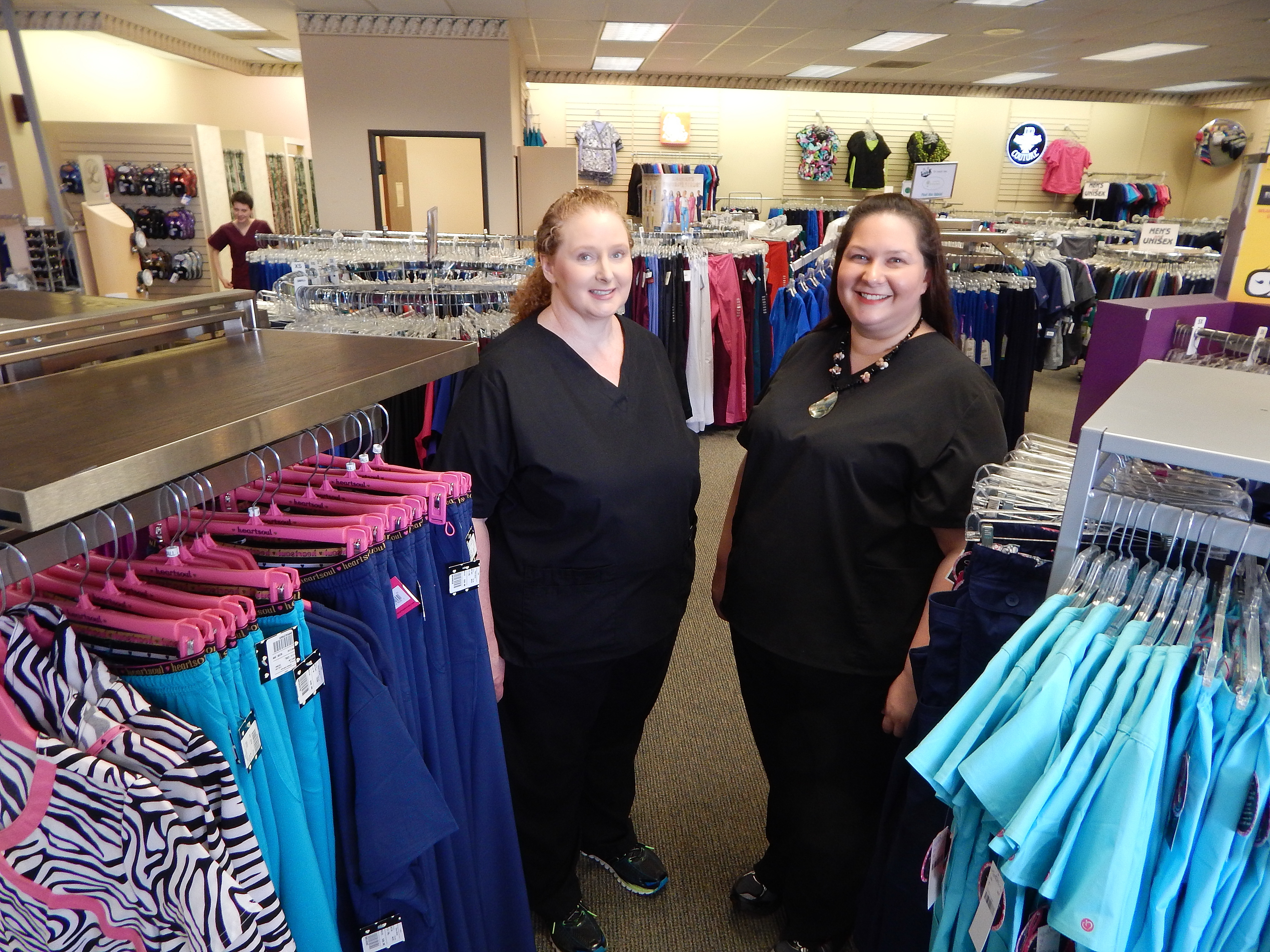 Uniform Shoppe manager Shari Stallings and sales associate Ericka Branham-Stapp stand ready to serve.